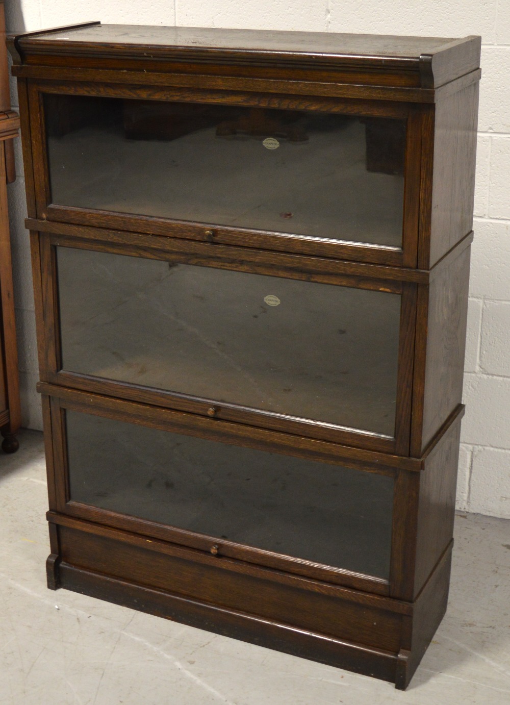 An early 20th century "Simpoles Chapter" three tier bookcase, width 87cm.