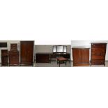 An eight piece Stag Minstrel bedroom suite comprising wardrobe, dressing table and stool,