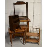 An oak monks bench of small proportions, a mahogany umbrella stand, a bamboo two tier book rack,