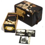 A 19th century ebonised box containing approximately 40 lantern slides with themes to include views