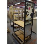 A stained wooden framed shop fitting with mirrored end and shelf attachment, width 121cm.
