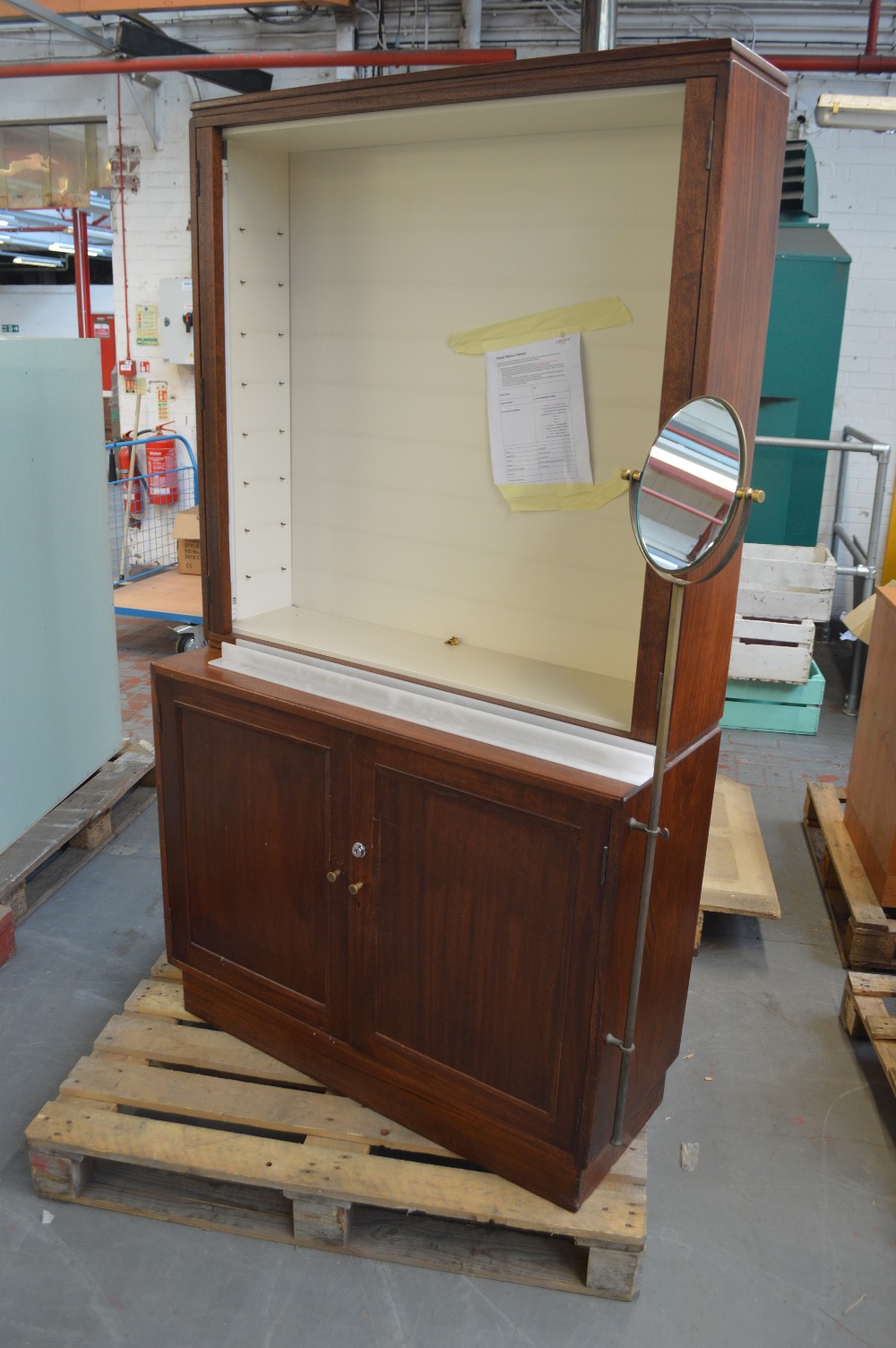 A mahogany bookcase with open upper section,