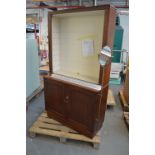 A mahogany bookcase with open upper section,