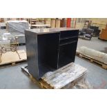 A metal display unit of rectangular form raised on plinth base, width 140cm.