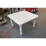 A white painted dining table,