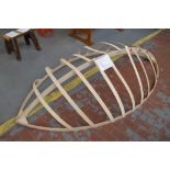 A Christmas display item in the form of a boat hull, length 240cm.