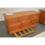 A walnut veneered shop display unit with six fall front cupboard doors, width 170cm.