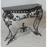 A French marble topped wrought iron base serpentine console table with floral decoration,