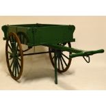 A vintage wooden hard cart painted in green, length including handle approx 250cm.