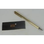 A 1980s cased Mont Blanc plated fountain pen with ribbed decoration,