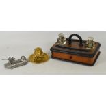 A late 19th century ormolu inkwell with hinged lid enclosing a replaced liner and mask set main