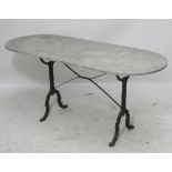 A rounded rectangular garden table with marble top and wrought iron base, length 167cm. CONDITION