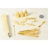 A bone fan, an early 20th century three piece ivory cruet set, a quantity of bone sticks,