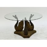 A contemporary decorative composite swan table with circular glass top, diameter 86.5cm.