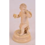 A 19th century Italian carved ivory figure of a Cupid holding a masquerade mask in one hand and