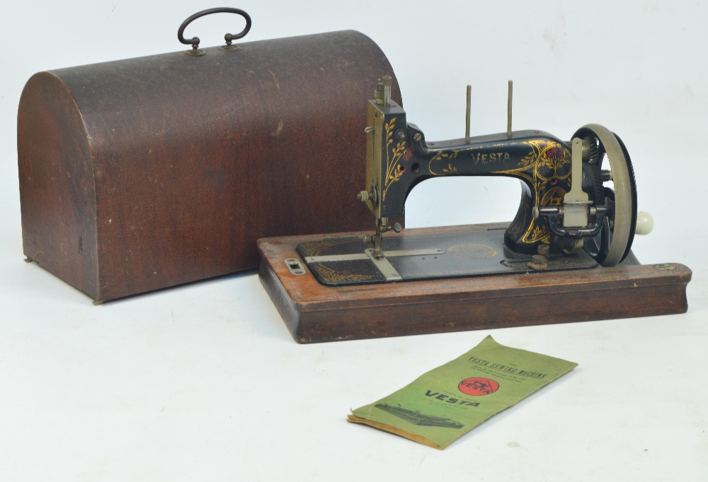 A cased sewing machine "Vesta".