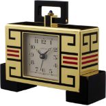 Weckeruhr "Cartier" Ende 20. Jh. Art-Déco-Stil. Gehäuse aus vergoldetem, partiell schwarz und rot