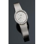 Reloj Joya de dama marca Omega con caja oval con orla de blancos y limpios brillantes. Un total de