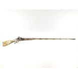 An Afghan Snaphaunce Musket, 48.25inch sighted two-stage barrel retained by seven embossed white