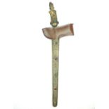 A Large Kris, 41cm wavy watered steel blade, brass hilt in the form of a god and decorated to the