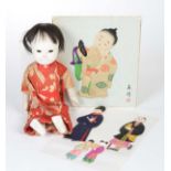 Reserve: 50 EUR    Asian Doll, original clothing, with 2 Asians out of paperboard with clothes,