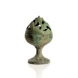 A SMALL BRONZE MOUNTAIN FORM CENSER
China, Han dynasty (206 BC – 220 AD). Height 11 cm.
  Reserve