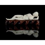 ? A CARVED IVORY MEDICINE LADY
China, Qing dynasty. Length 15 cm.
Model used in Chinese medicine for