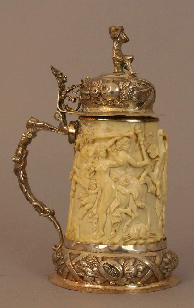 Ivory tankard, oval cylindrical form with depth carved figural scene of the Centaurus and rape of