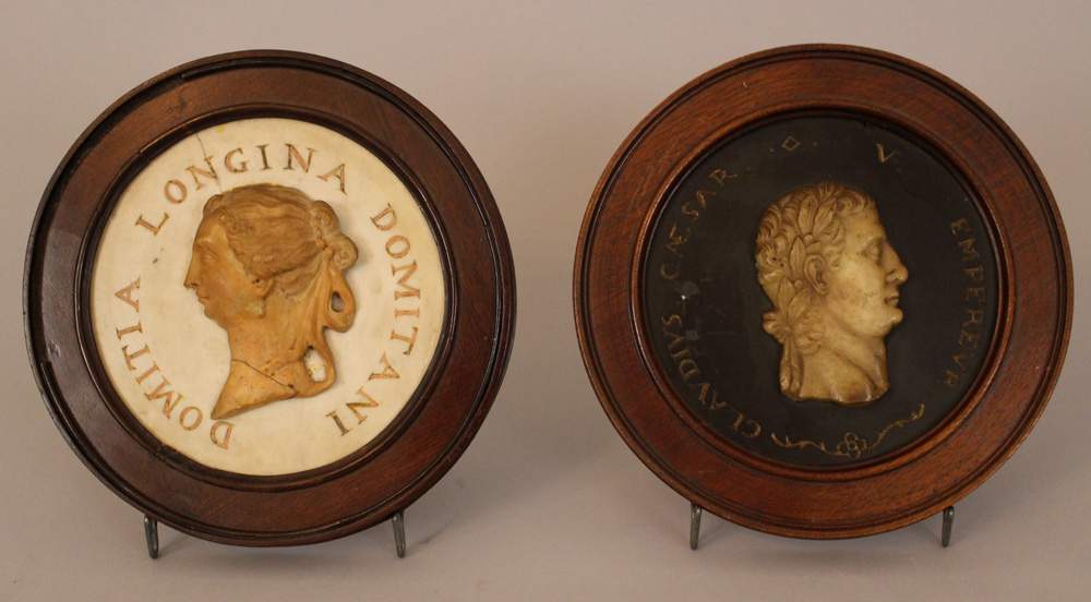 A pair of portraits: Domitia Longina and Claudius Caesar; pink and white marble on black stone
