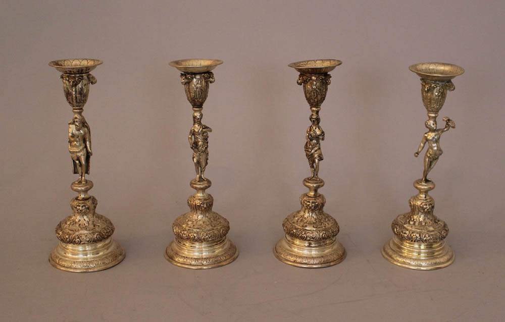 Four season candle sticks, silver with four allegorical figures in the center, each with one spout