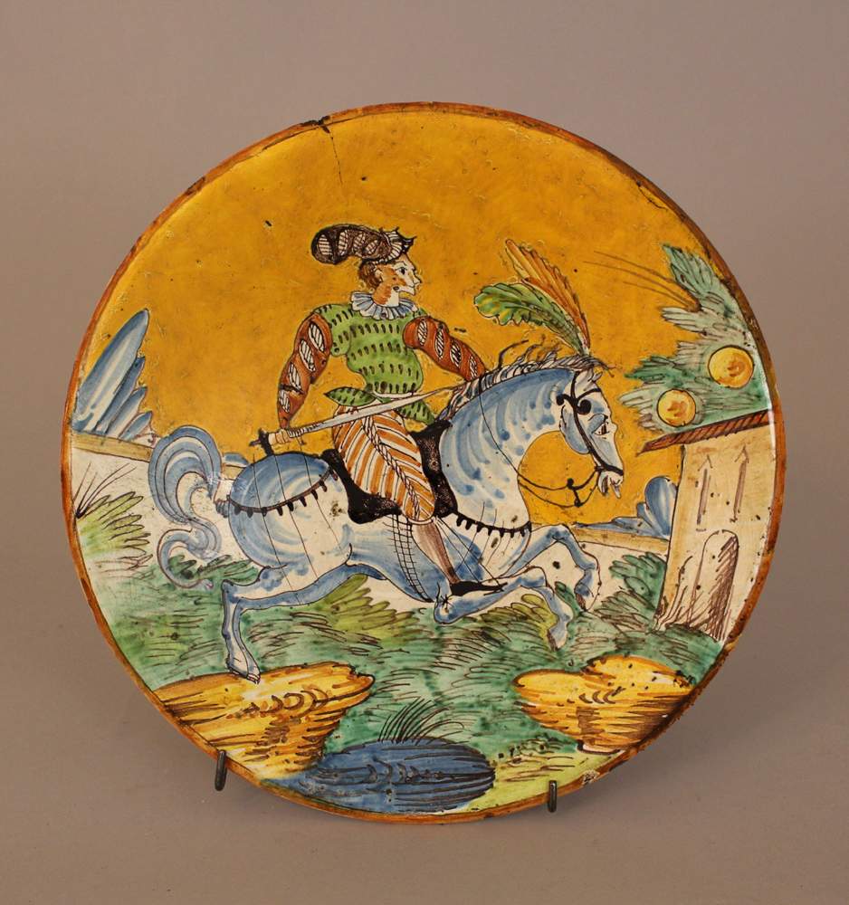 Montelupo ceramic salver, round shape, with painted horse rider in landscape in the centre,