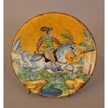 Montelupo ceramic salver, round shape, with painted horse rider in landscape in the centre,