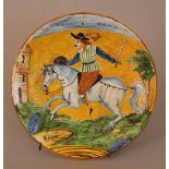 Montelupo ceramic salver, round shape, with painted horse rider in landscape in the centre,