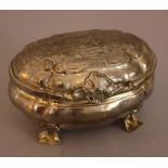 German baroque sugar box, oval shaped form on four floral shaped feet, stepped lid with decorated