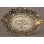 Silver basket with open work in baroque manner, in the center and on the side with engraved