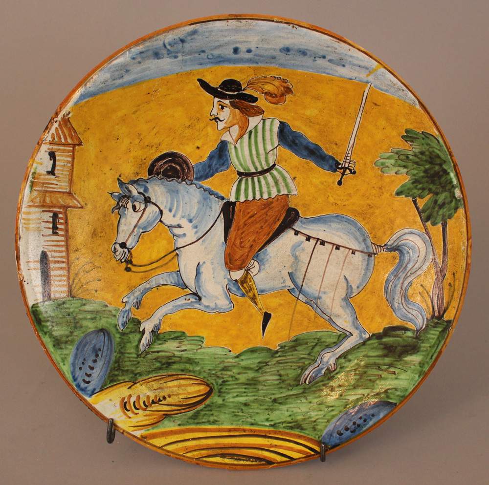 Montelupo ceramic salver, round shape, with painted horse rider in landscape in the centre, - Image 2 of 3