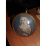 A Miniature Watercolour Portrait of a Gentleman in ceremonial dress, set in circular copper frame