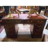 An Early Victorian Mahogany Double-Pedestal Kneehole Desk, fitted nine drawers.