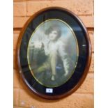 A Colour Print, Continental Boy Holding a Pet Rabbit, in oval eglomisé mount.