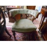 A Victorian Carved Oak Framed Tub Chair, upholstered in pale green dralon, standing on turned and