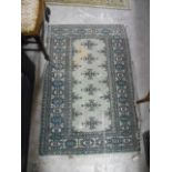 A Middle Eastern Style Runner with central medallions on an off-white ground within multi-borders,