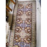 A Persian Brown Ground Runner with allover geometric decoration.