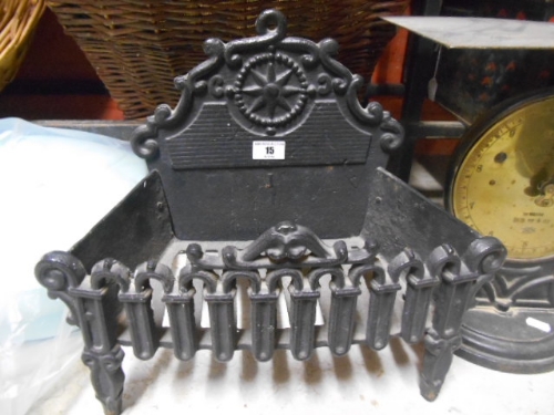 A Decorative Miniature Black Cast Iron Fire Grate.