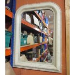 A Wall Mirror of Arched Form, with cream frame.