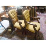 A Pair of Victorian Style Continental Mahogany Armchairs with gold deep-buttoned back upholstery.