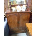 A Mahogany & Inlaid Veneer TV Cabinet with two cupboard doors above two long drawers. 3'3" tall.