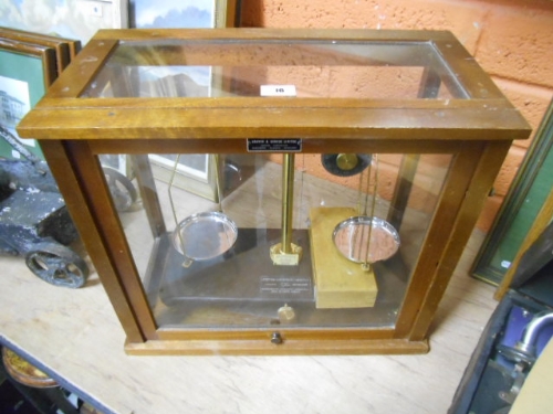 An Early 20th Century Griffin & George Brass Scientific Balance with bakelite base, in mahogany