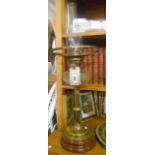 Amendment to Catalogue: An Early 20th Century Oil Lamp with clear glass reservoir, this standing