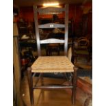 A Mahogany Ladder-Back Chair with rush seat.