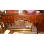 An Edwardian Inlaid Mahogany Kneehole Writing Table with frieze drawer flanked by two further either